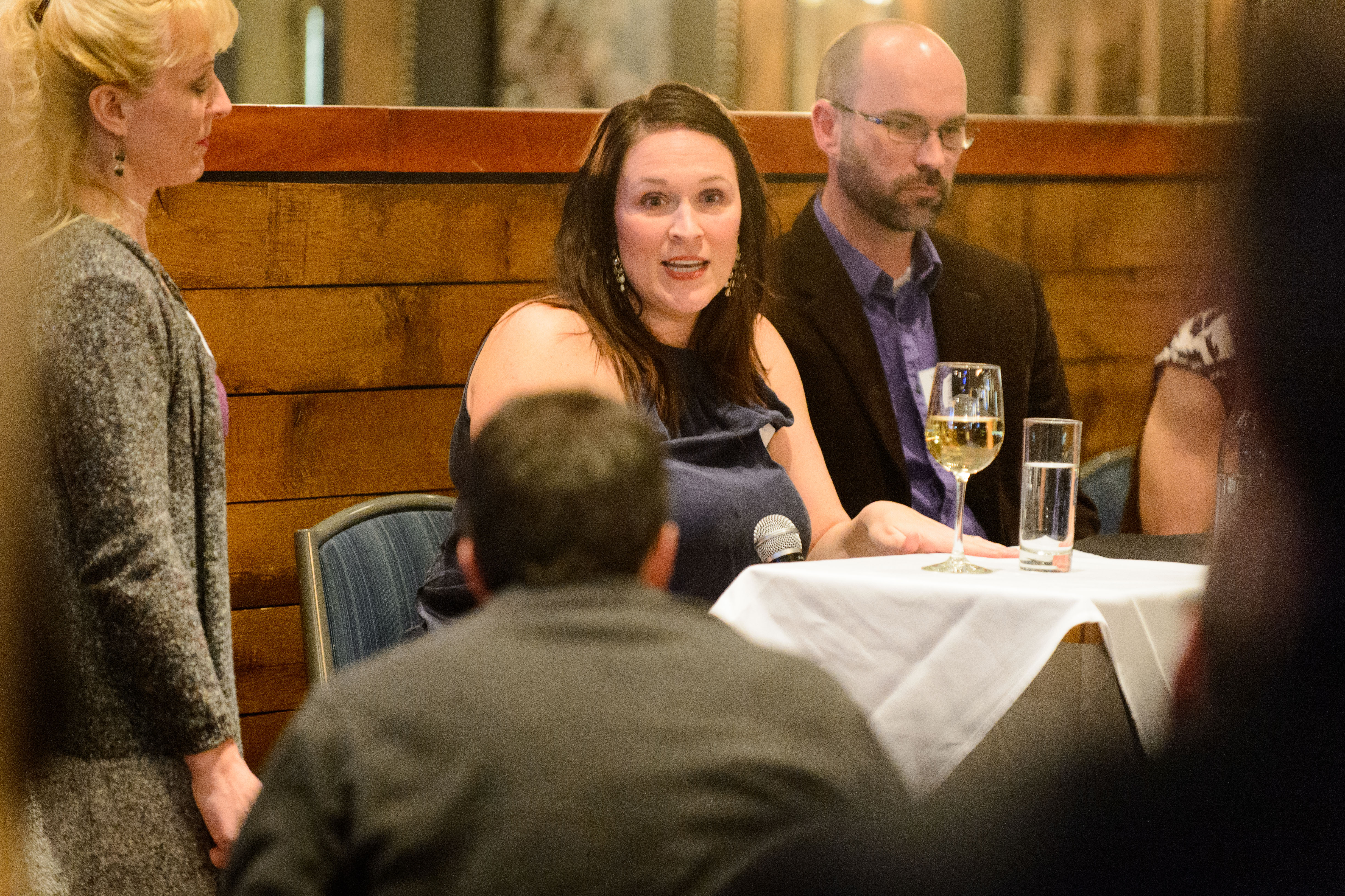 Erin Young, assistant professor of nursing, center, responds to a question during a UConn Science Salon on pain. Sittting at left is her husband and fellow pain researcher, assistant professor Kyle Baumbauer. (Peter Morenus/UConn File Photo)