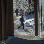 Students make their way to class outside the School of Nursing's Widmer Wing. (Sean Flynn/UConn Photo)