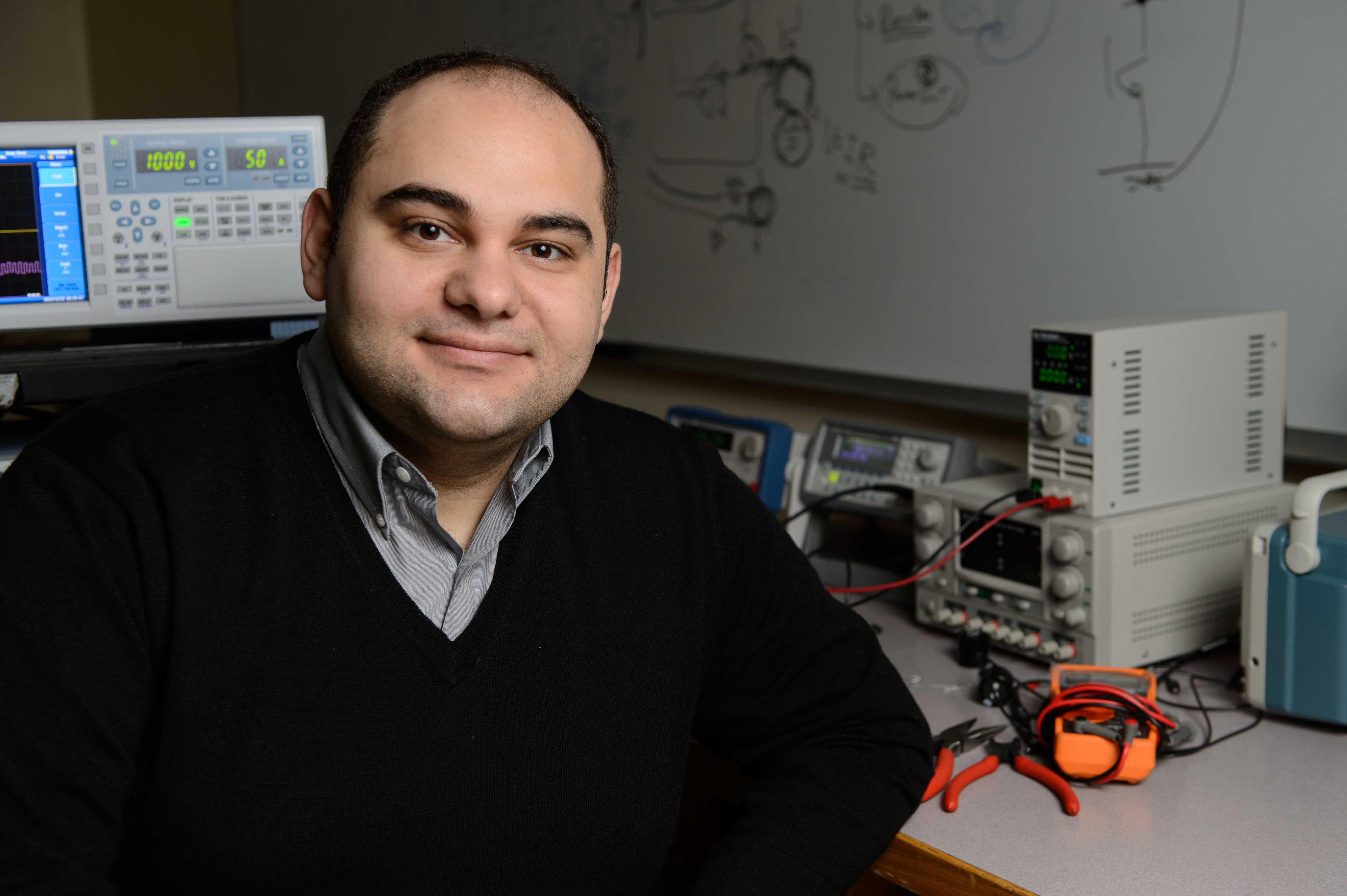 Ali Bazzi, assistant professor of electrical and computer engineering at his lab on Dec. 21, 2012. (Peter Morenus/UConn Photo)