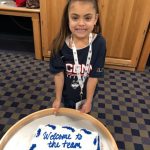 Daniela poses with her welcome cake at a party hosted by the Women's Basketball team after her signing ceremony on Nov. 11, 2018.