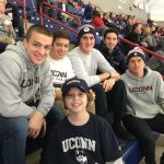 Maddox, foreground, and five other members of the UConn Men's Soccer team at a Men's Basketball game at Gampel Pavilion. (Photo by Sherry Bruening)