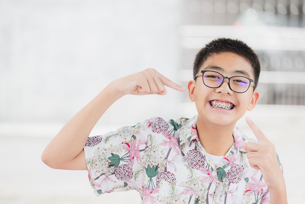 Smiling teen with braces