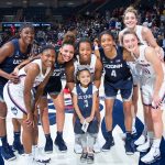Daniela with members of the Women's Basketball team at First Night on Oct. 12, 2018. She says 'all' the players are her favorites. (Stephen Slade '89 (SFA) for UConn)