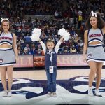 Daniela with cheerleaders at Gampel Pavilion, the night of the team's season opener against Ohio State on Nov. 11, 2018. (Stephen Slade '89 (SFA) for UConn)