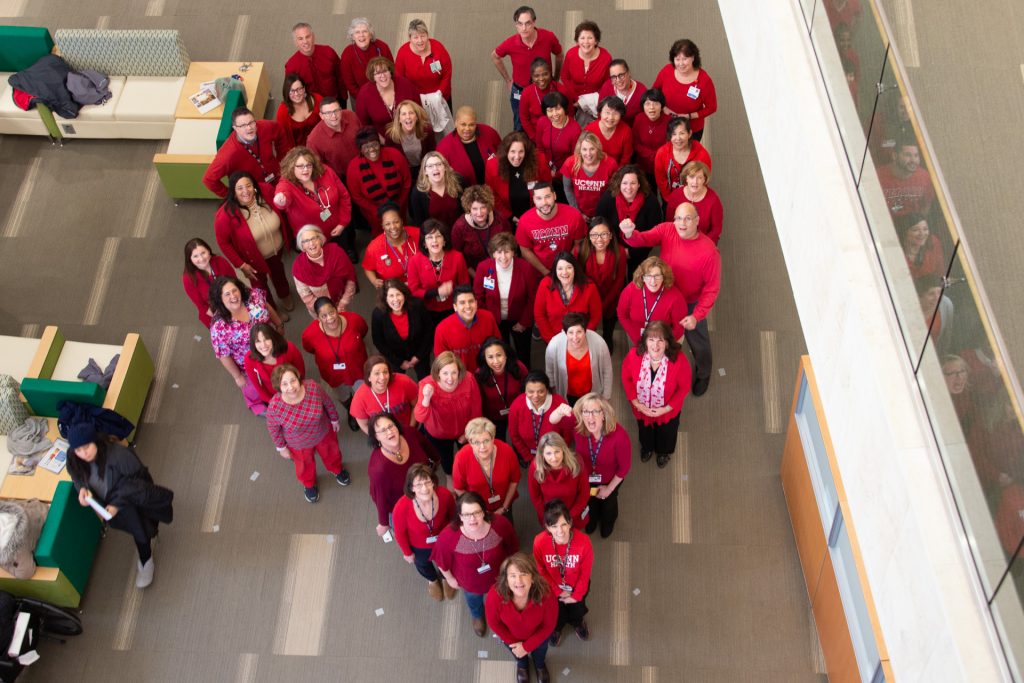 Staff at UConn Health donned their red gear and formed a large heart in the main lobby, dedicated to raising awareness about cardiovascular disease, and kicking off American Heart Month on Feb. 1, 2019. (Tina Encarnacion/UConn Health Photo)