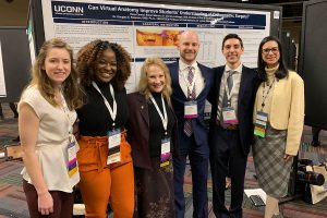 UConn dental students Kathryn Forth and Chiddi Okafor, Dean Sharon Gordon, students Rob Morrin and Russ Camiel, and Associate Dean for Students Sarita Arteaga