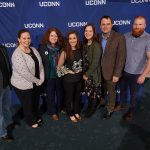 Helena Debald, center, poses for a photo with First Year Programs and Learning Communities colleagues following the Spirit Awards ceremony. (Peter Morenus/UConn Photo)