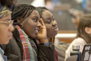 Lauryn Bryant ’21 (NUR), left, and Natalie Akumiah ’21 (NUR) listen to a lecture in the Widmer Wing of the School of Nursing. (Sean Flynn/UConn Photo)