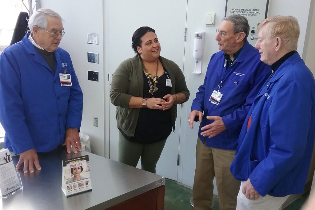 Maria Santiago with volunteers Stephen Schneeberger, Bruce Hamilton, and Reggie Lavoie