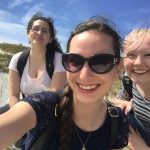 Anna Aldrich, center, at the Cliffs of Dover with UConn students Sarah Motta, left, and Addison Kimber.