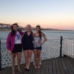 Anna Aldrich, right, in Brighton, England, with UConn students Sarah Motta, left, and Addison Kimber.