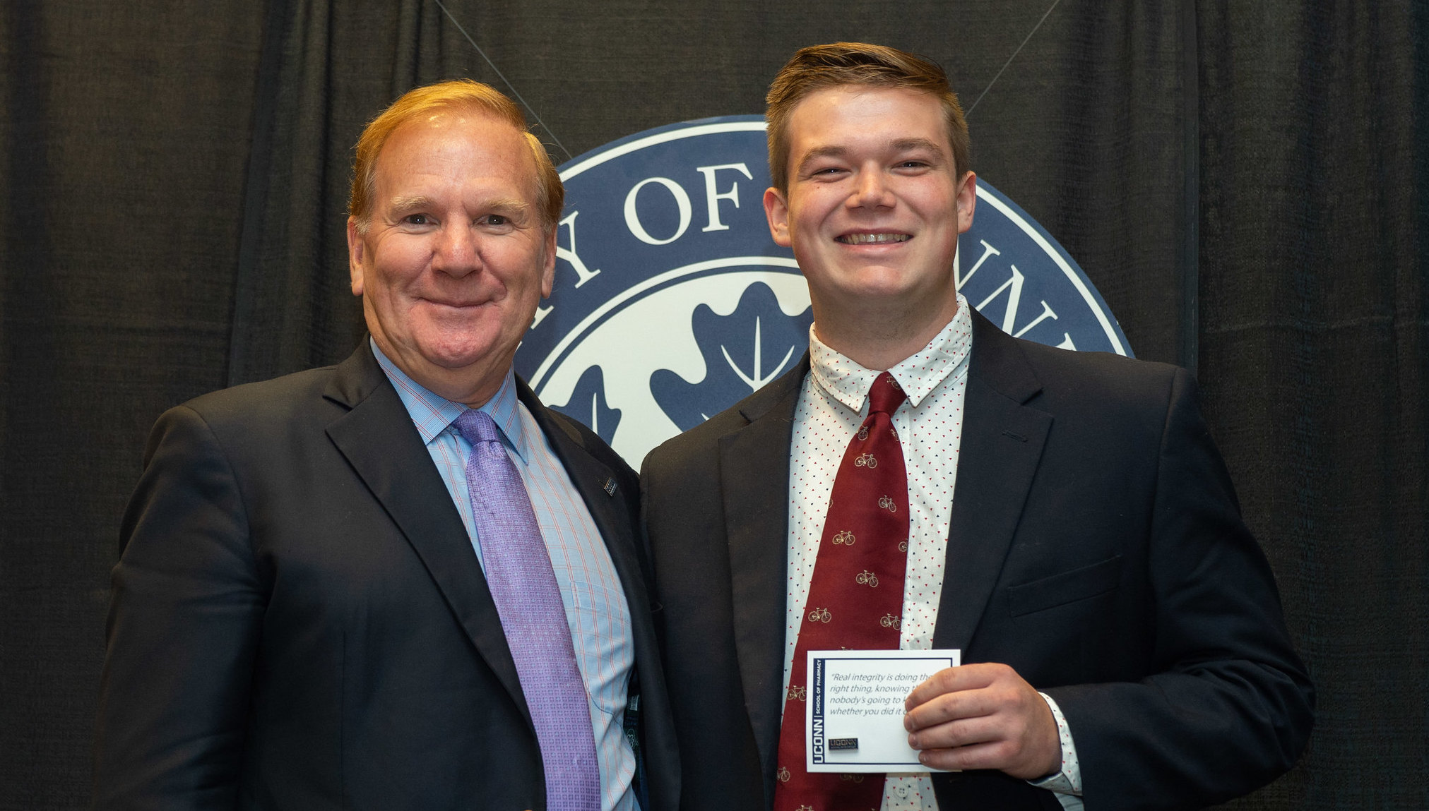 Canyon Hopkins at the UConn School of Pharmacy pinning ceremony with Dean James Halpert.