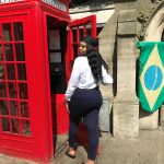 Drew Asia-Keating checks out an iconic phone booth ('telephone box') in London.