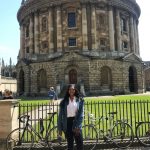 Drew Asia-Keating in front of the Radcliffe Camera in Oxford, part of the University of Oxford Library.