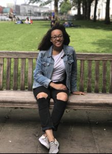 Kimberly Duhart relaxes on a bench. 