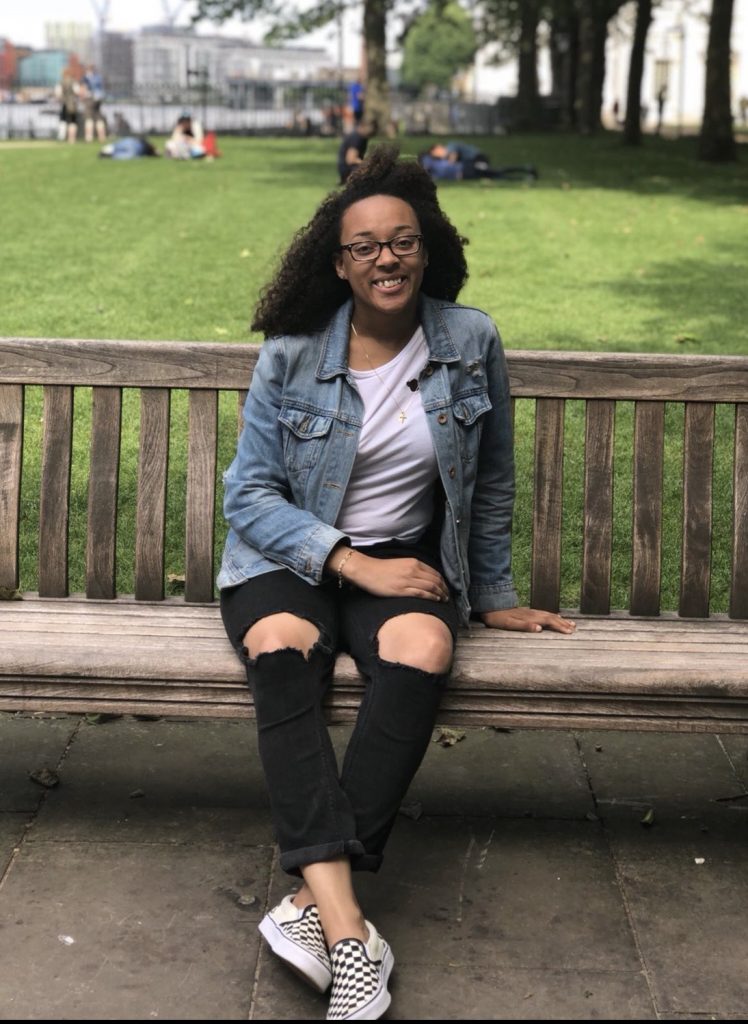 Kimberly Duhart relaxes on a bench.