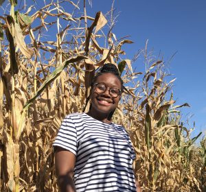 Konjit Richards-Johnson takes a study break outside some corn husks.