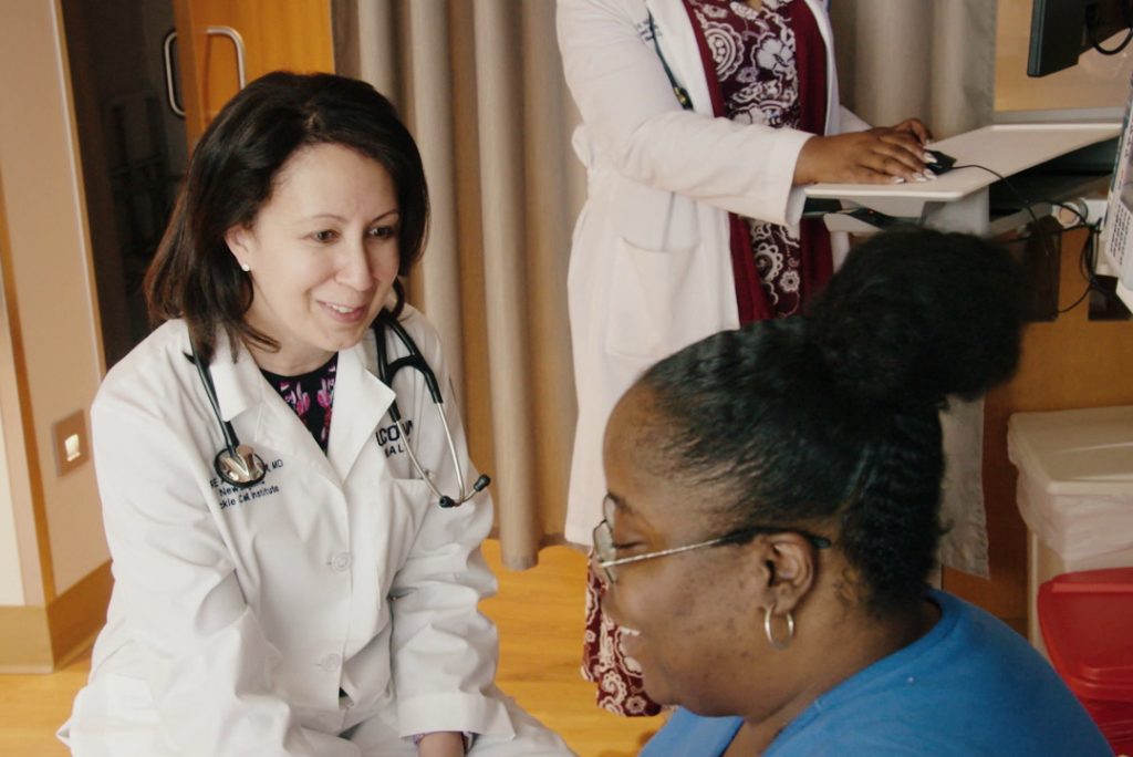 Dr. Andemariam with a patient