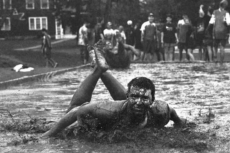 Matt Kenny takes a slide during the 1996 Oozeball tournament, a part of Spring Weekend. (Jonathan Cohen/UConn File Photo)
