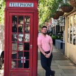 Omaniel Ortiz '20 (CAHNR) outside a phone booth, or 'telephone box,' in the London neighborhood where the UConn group lived.