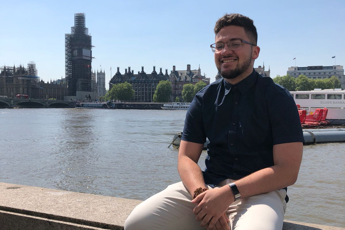 Omaniel Ortiz '20 (CAHNR) by the River Thames with Big Ben (shrouded in scaffolding) in the background. Big Ben, the iconic clock tower of the Houses of Parliament in London, is currently undergoing major renovations.