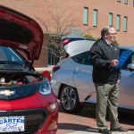 Craig Peters of the Clean Cities of Connecticut organization talks to students about the environmental benefits of electric cars. (Lucas Voghell ’20 (CLAS)/UConn Photo)