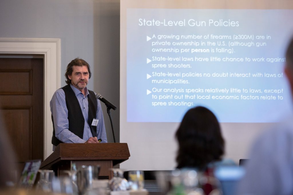 Blair T. Johnson, Board of Trustees Distinguished Professor of Psychology, presents at the Correlates, Causes, and Solutions for Firearm Violence in America conference at the Hartford Club on April 4, 2019. (Bri Diaz/UConn Photo)