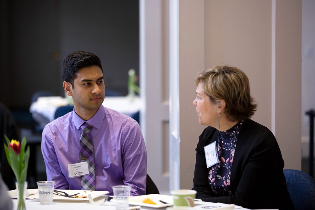 Saurabh Kumar speaks with physiology and neurobiology professor Joanne Conover during the Office of National Scholarships and Fellowships' 2019 Celebration of Excellence at the Alumni Center on April 23. (Bri Diaz/UConn Photo)