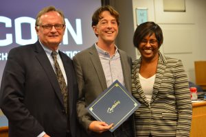 Michael Coyne (center) was recognized by Associate Dean Del Siegle (left) and Dean Gladis Kersaint as the Neag School’s 2017 Distinguished Scholar. This August, Coyne will begin serving as the head of the Neag School Department of Educational Psychology. (Shawn Kornegay/Neag School)