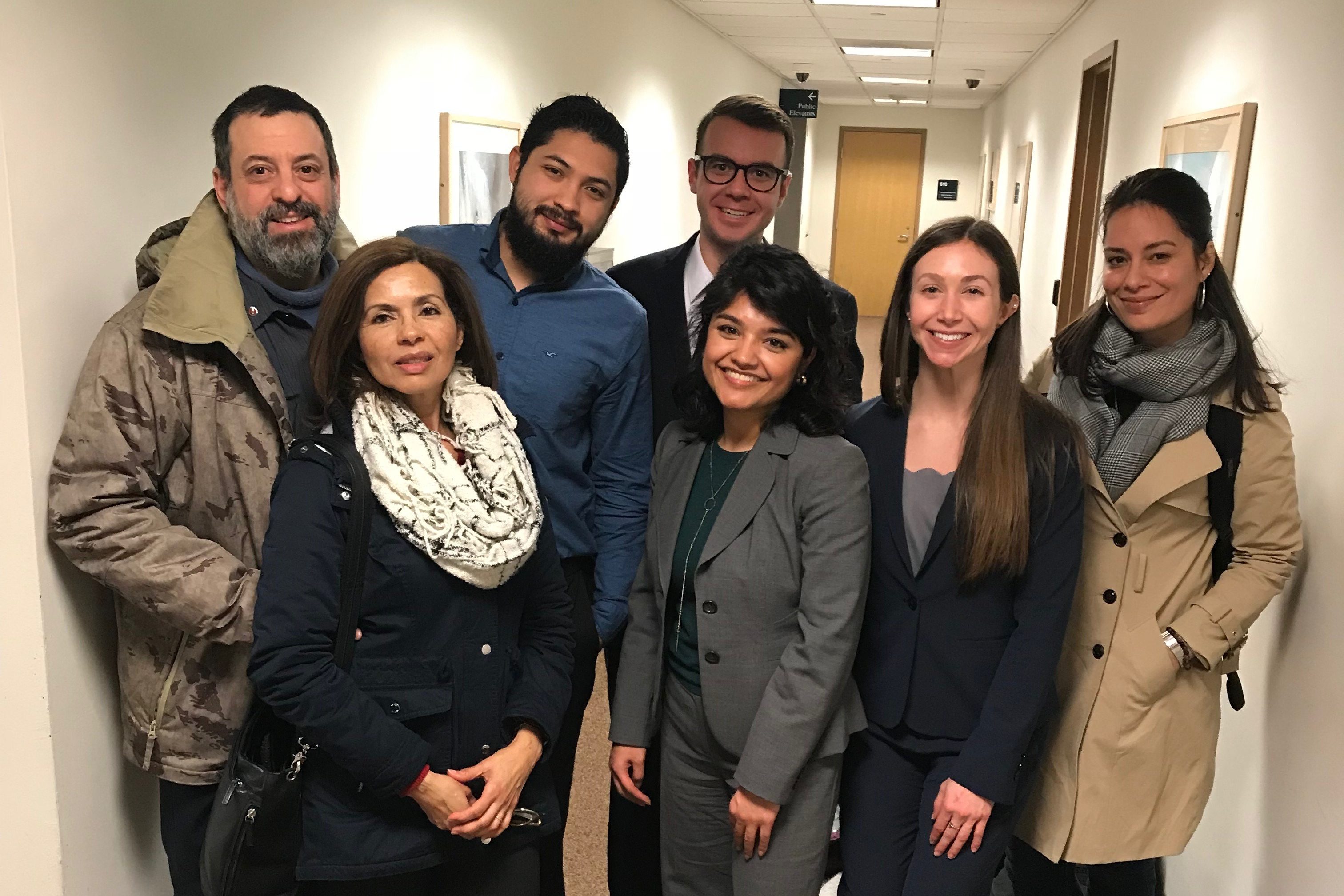 Left to right, two members of the Galdamez family; Franklin René Ruano Galdamez; Adam Kuegler (back) law student; Valeria Gomez, William R. Davis Clinical Fellow at UConn Law; Alexandria Madjeric, law student; and Thais Ortolaza, UConn School of Social Work student intern. (Camille Chill/UConn Photo)