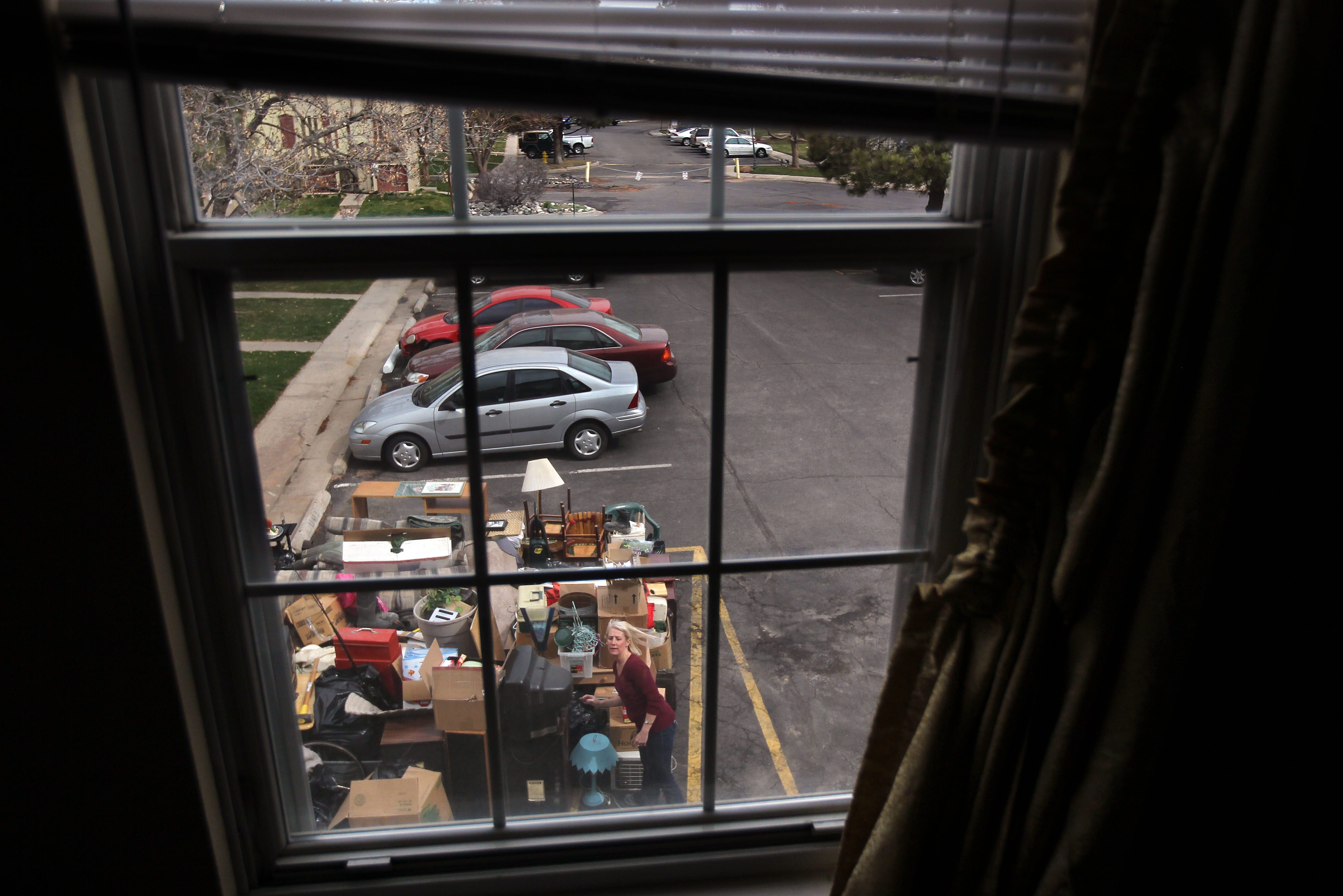 An eviction team removes belongings from a family's rented apartment after tenants failed to pay rent for almost three months. (John Moore/Getty Images)