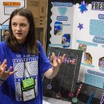 Madison Cavill, 10, shows off her invention 'Fresh-E,' designed to give people a personalized way to combat odor. (Lucas Voghell ’20 (CLAS)/UConn Photo)