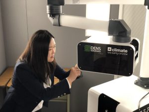 Yuanyuan Zhu, director of the InToEM center, works with the DENSsolution Climate system at UConn Tech Park. (UConn Photo)