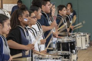Kids of the Kennelly Premier Drumline, led by teachers Mike Pontecorvo and Jessica Hogan, celebrate UConn at Kennelly School on May 2, 2019. (Sean Flynn/UConn Photo)