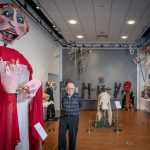 Bart Roccoberton standing next to 'The Red Queen' for the Insurance Company. The Ballard Museum and Institute of Puppetry is celebrating Roccoberton’s career as a puppeteer and educator with 'It’s Always Pandemonium,' an exhibition of nearly 100 puppets created by Roccoberton, his Pandemonium collaborators, and dozens of UConn Puppet Arts students under his guidance. (Sean Flynn/UConn Photo)