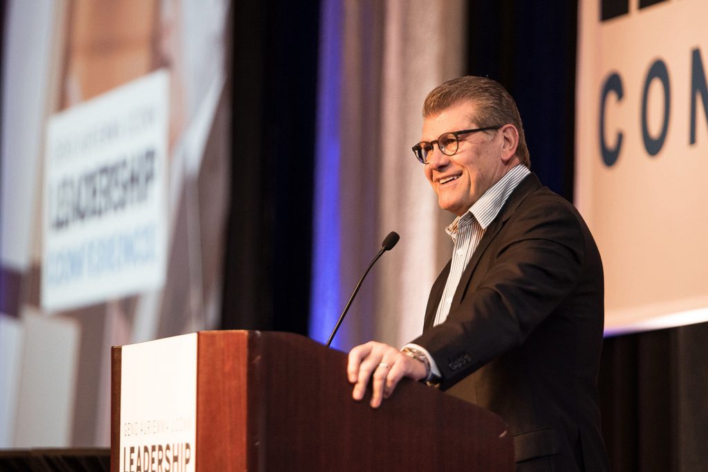 Geno Auriemma greets the crowd at the 2018 conference. (Nathan Oldham/UConn School of Business)