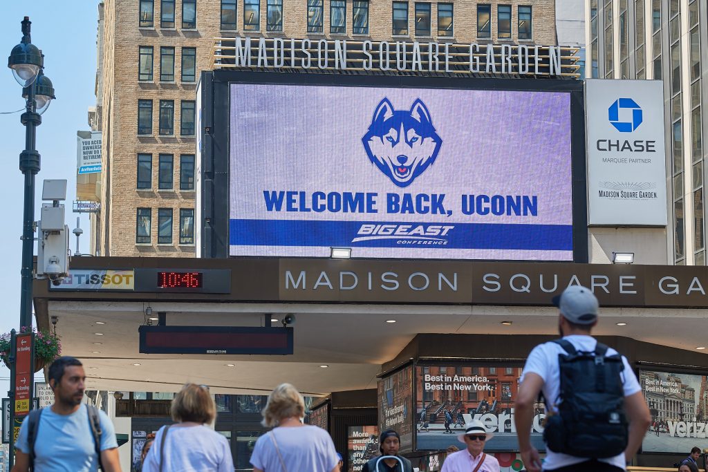 A marquee welcoming UConn back to the Big East seen outside Madison Square Garden along 7th Avenue in Manhattan on June 27, 2019. (Peter Morenus/UConn Photo)