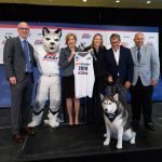 From left, Dan Hurley, men's basketball head coach, left, Jonathan the Husky, President Susan Herbst, Val Ackerman, Big East commissioner, Geno Auriemma, women's basketball head coach, and David Benedict, athletic director, pose for a photo with Jonathan XIV at an event held at Madison Square Garden to announce UConn's return to the Big East athletic conference. (Peter Morenus/UConn Photo)