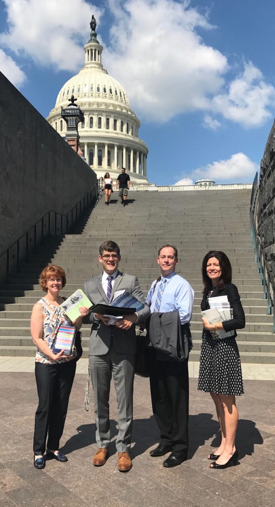 Professor of human development and family sciences Preston Britner, second from right, and co-investigator Anne Farrell of Chapin Hall at the University of Chicago, right, at the Capitol Building n Washington, D.C. (Contributed Photo)