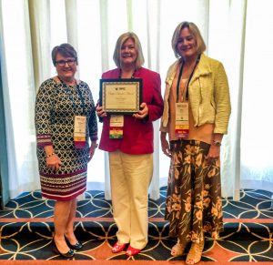 UConn Health's Nancy Dupont (center) receiving her Chapter Leader Award at APIC 2019 in Philadelphia on June 11 (Photo Courtesy of Rachel Crosby/UConn Health).