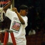 Jamelle Elliott takes her turn cutting down the net following the 1995 NCAA national championship game in Minneapolis. (Athletic Communications)