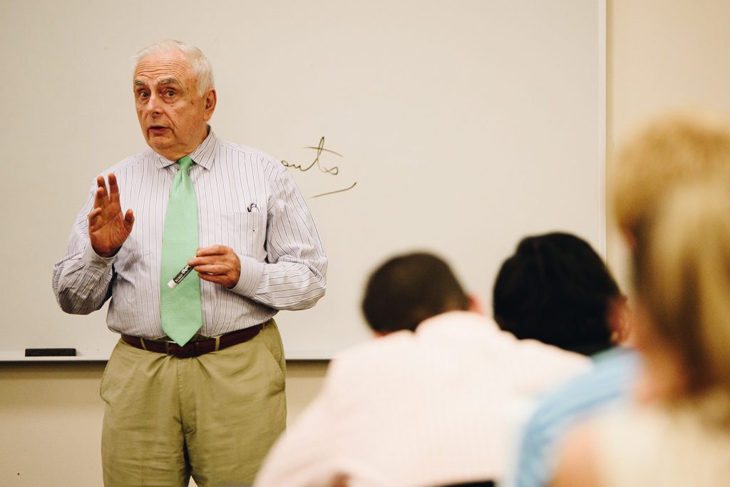 Pictured above, Vincent Carrafiello teaching during his time at UConn. He passed away at the age of 78. (Nathan Oldham / UConn School of Business)