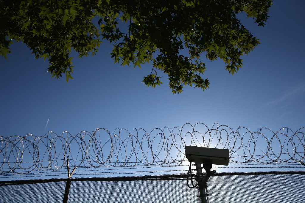 A fence topped with razor wire outside York County Detention Center in York, Pa.