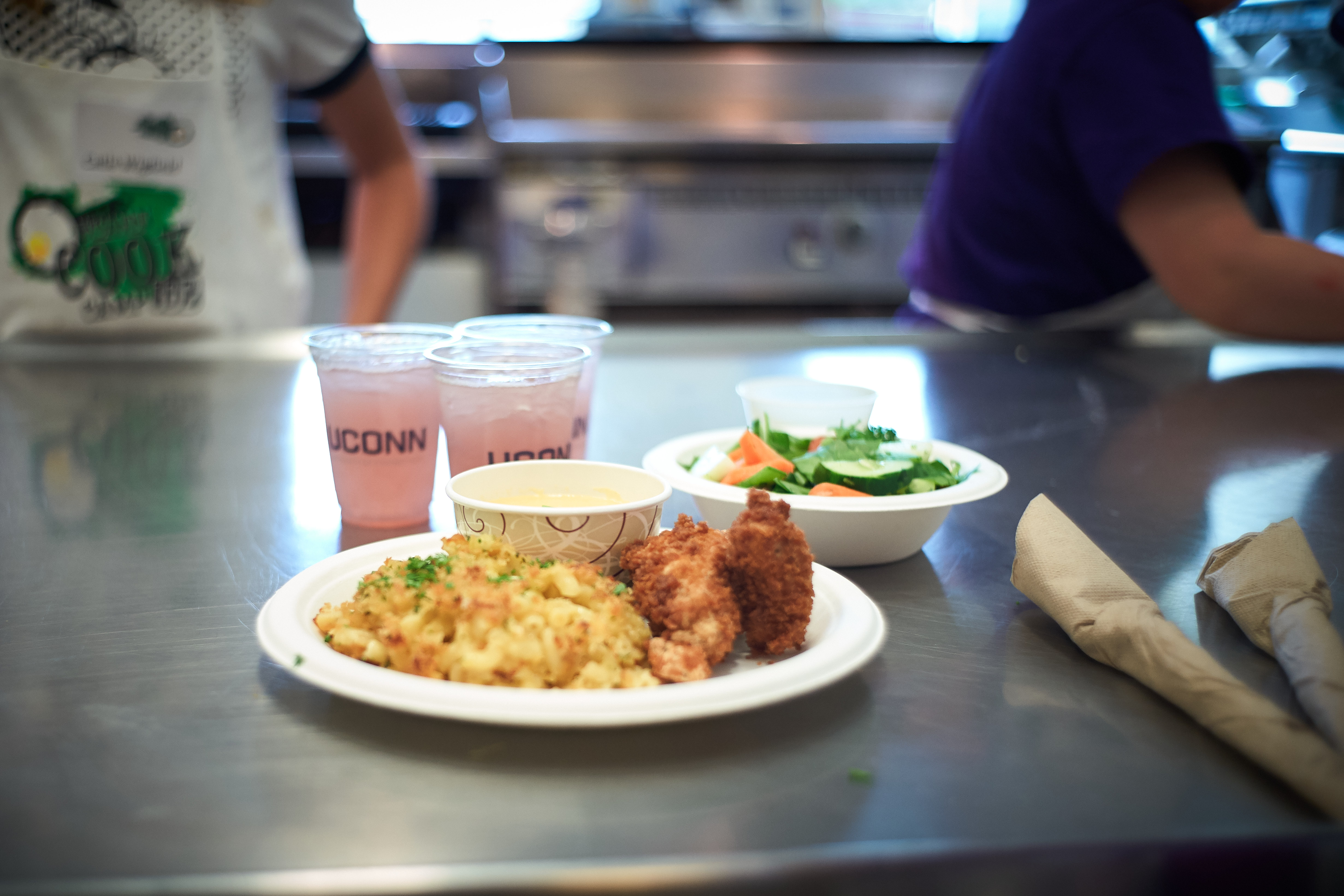 Mac 'n cheese, chicken nuggets, sauce and a vinaigrette salad was one team's entry during a competition at the UCann Cook Camp at Gelfenbien Commons on July 18, 2019. (Peter Morenus/UConn Photo)