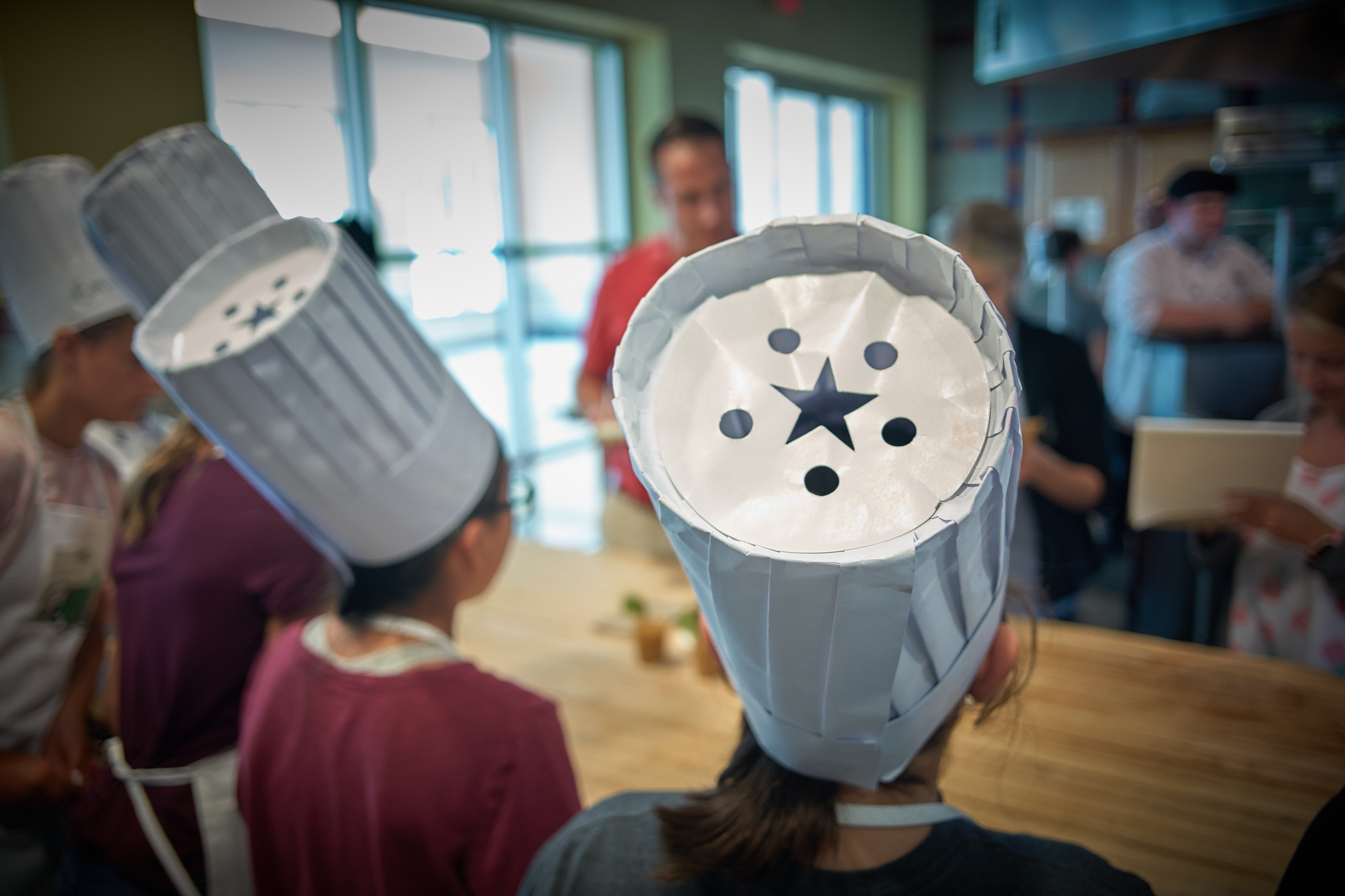 Campers wore aprons and chefs hats during the UCann Cook Camp at Gelfenbien Commons on July 18, 2019. (Peter Morenus/UConn Photo)