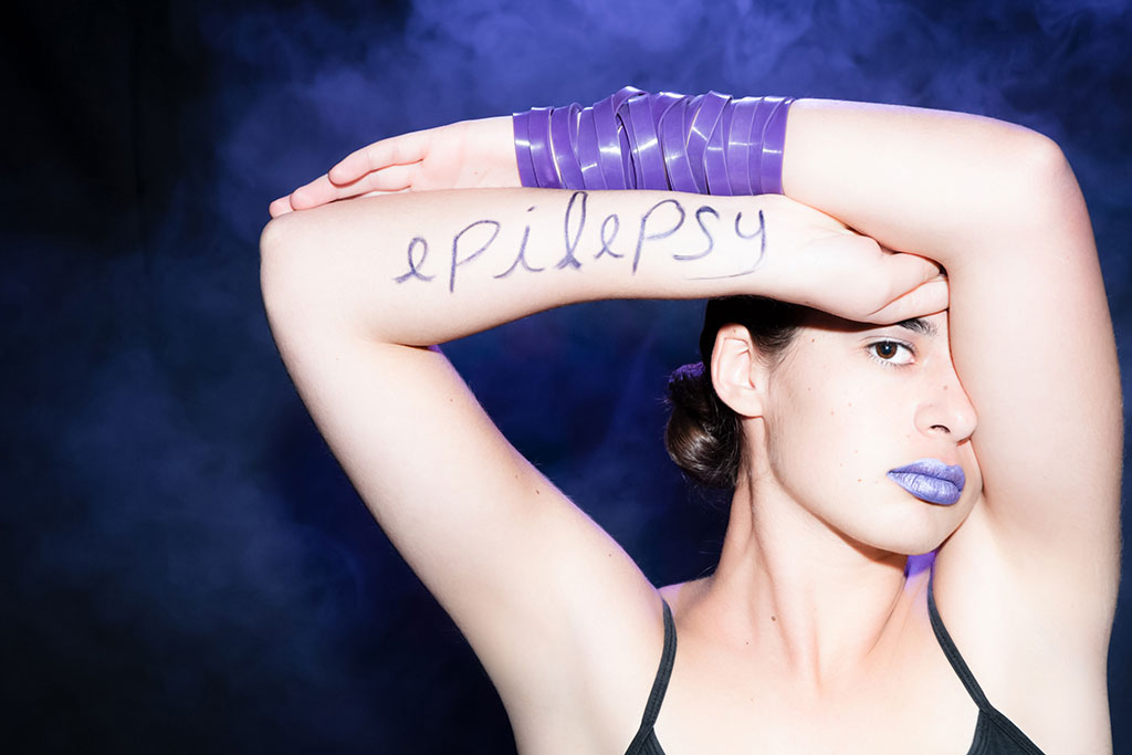 Woman with "epilepsy" written on her arm