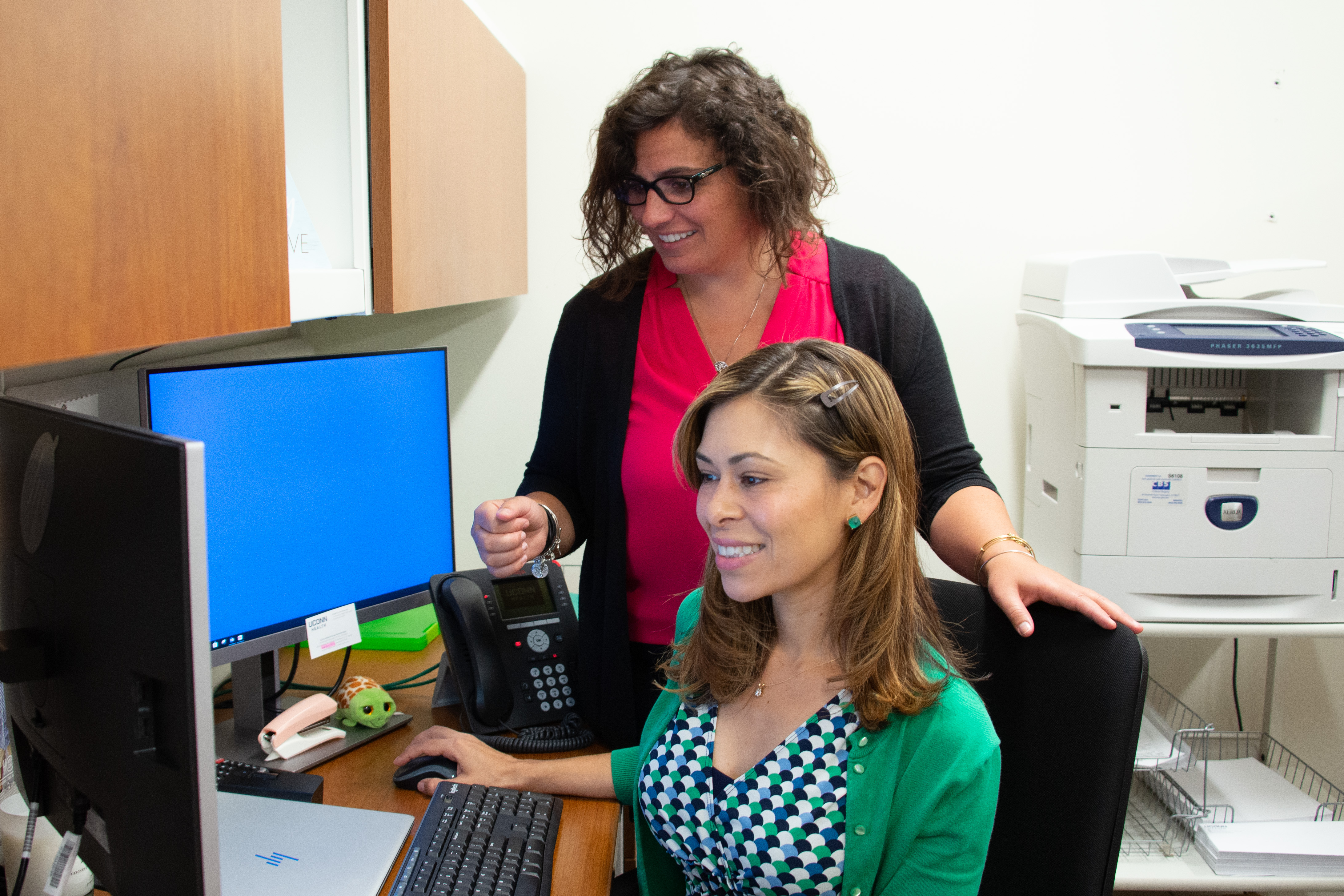 Celena Kapushinskiand Angelica Van Ostrand in UConn Health's population health office