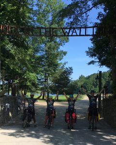 Yoga, Keanna, Liz and Justin raise their arms in triumph at the camp.