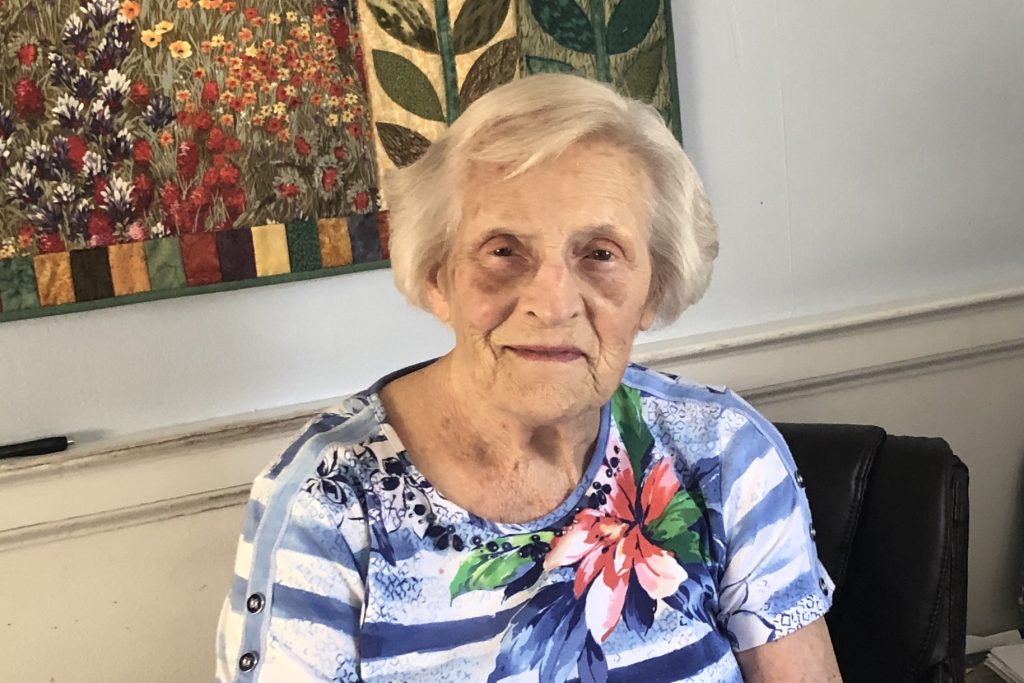 Dorothy Graves seated in her home