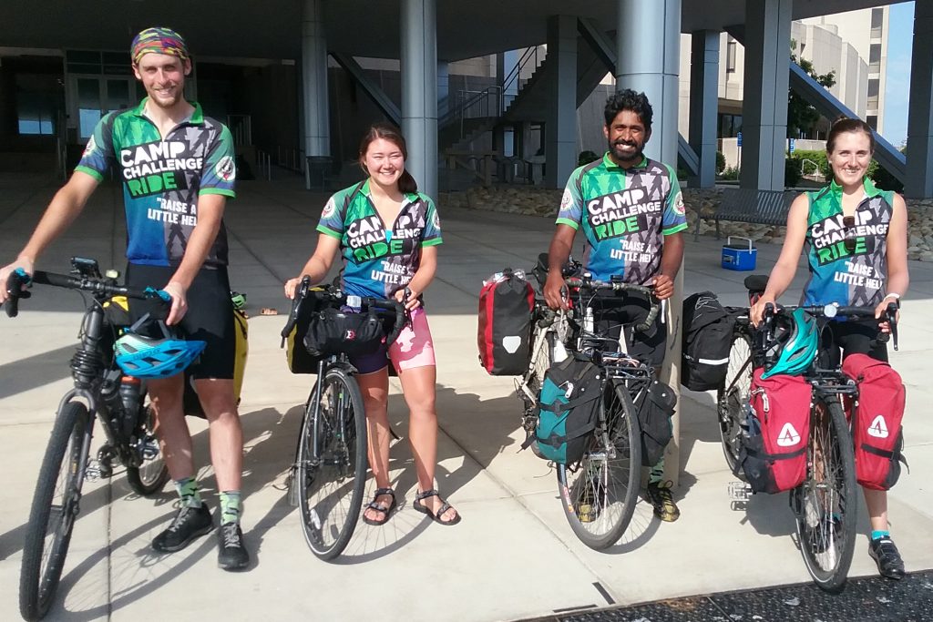 Justin, Keanna, Yoga, Liz on their bikes at the academic entrance